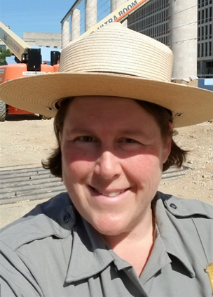 Selfie of Jen Epstein in her NPS uniform while wearing a hat